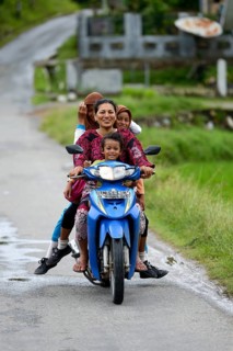 Woman with three girls on a motorcycle