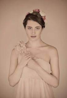 Beauty portrait of a young woman with flowers in her hair