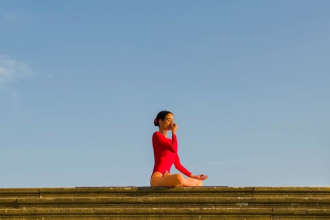 Young woman practising Hatha yoga