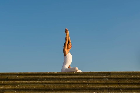 Young woman practising Hatha yoga