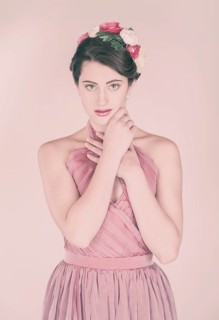 Beauty portrait of a young woman with flowers in her hair