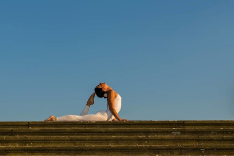 Young woman practising Hatha yoga