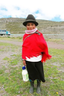 Girl in traditional costume with milk jug
