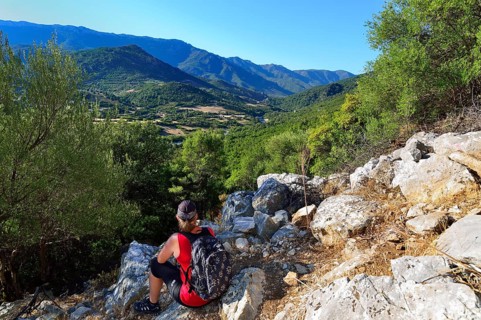 Tourist on a hike along an old charburner's path