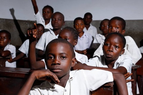 School children in school uniform during class
