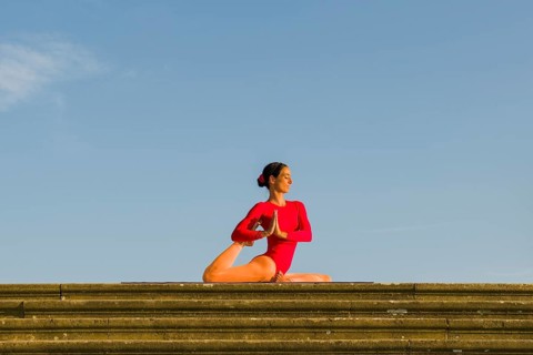 Young woman practising Hatha yoga
