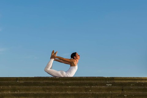 Young woman practising Hatha yoga
