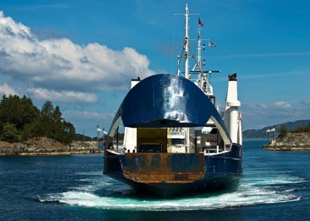 Ferry approaching the pier with an open bow section