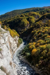 The caucasian mountains in fall with the Argun river