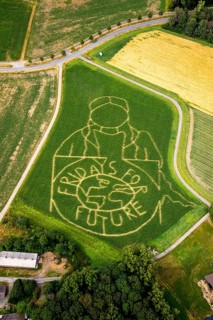 Aerial view of the FRIDAYS FOR FUTURE emblem with climate activist Greta Thunberg as corn labyrinth on a field in Cappenberg