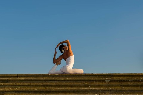 Young woman practising Hatha yoga