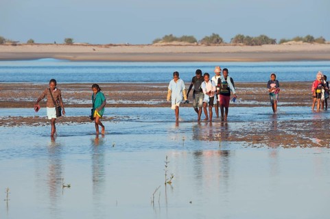 Malagasy people crossing the water