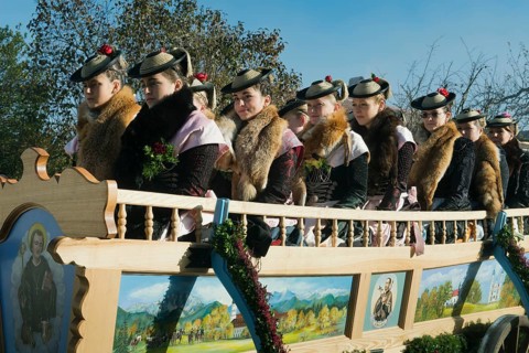Women in a carriage wearing traditional costume