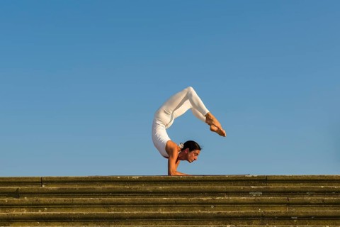 Young woman practising Hatha yoga