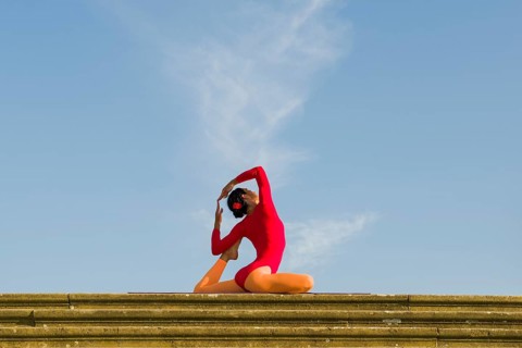 Young woman practising Hatha yoga