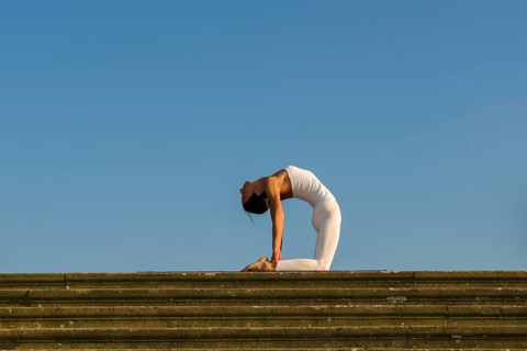 Young woman practising Hatha yoga