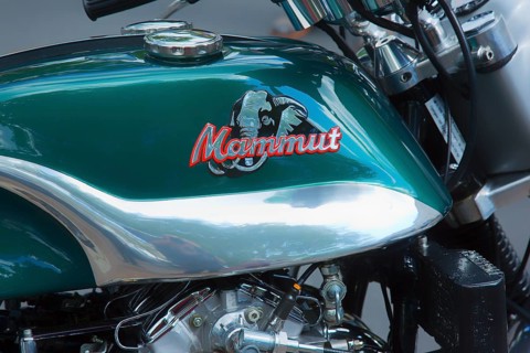 The logo on the motorcycle tank of the Munch 4 Mammut TTS-E