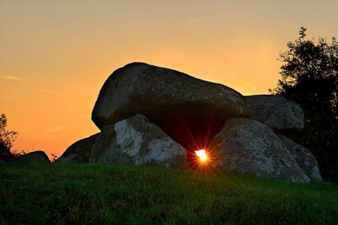 Sunbeam shining through the Sprove Dolmen at sunset