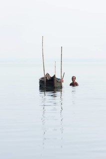 Cockle picker at his boat