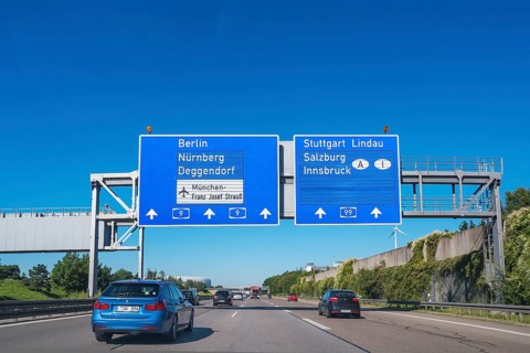 Information signs and greened noise protection wall on the A9 near Munich