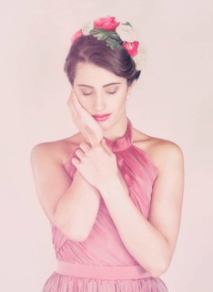 Beauty portrait of a young woman with flowers in her hair
