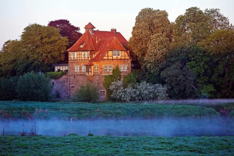 Petershagen Castle on the River Weser at sunrise