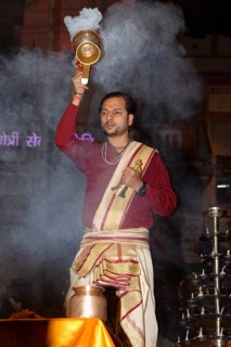Priest celebrating the Aarti by offering incense