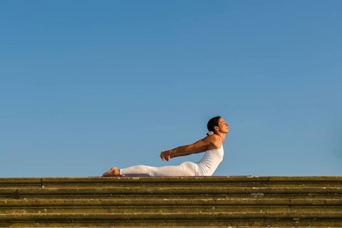 Young woman practising Hatha yoga