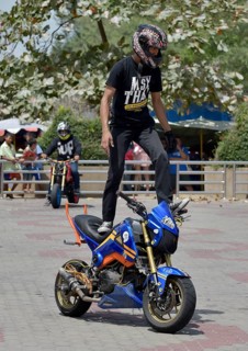 Motorcycle stunt rider performing