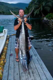 Man with huge sword fish