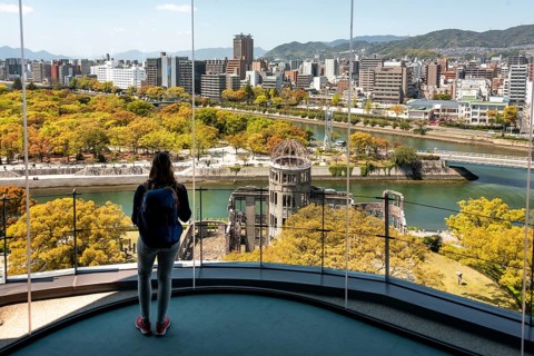 Woman looking from observation platform of Hiroshima Orizuru Tower