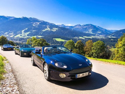 Aston Martin DB7 Vantage Volange cars on a mountain road near Kitzbuhel