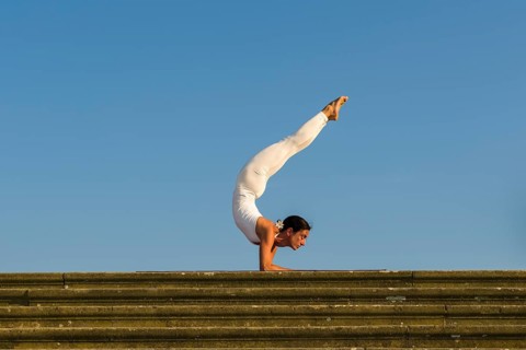 Young woman practising Hatha yoga