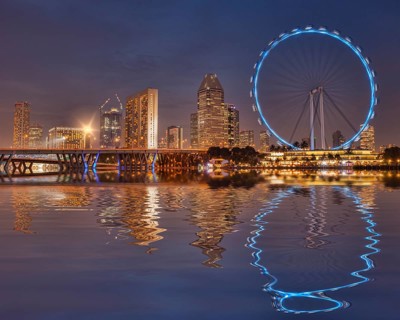 Singapore Flyer and Skyline reflected in the waters of Marina Bay