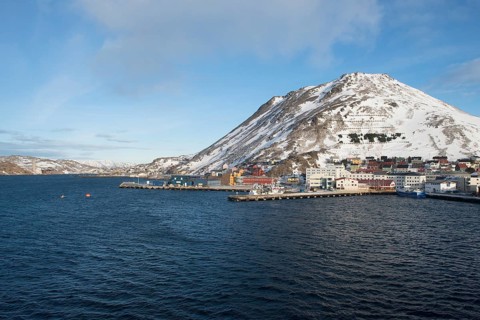 Townscape with piers and snow-covered mountain