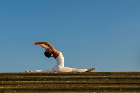 Young woman practising Hatha yoga