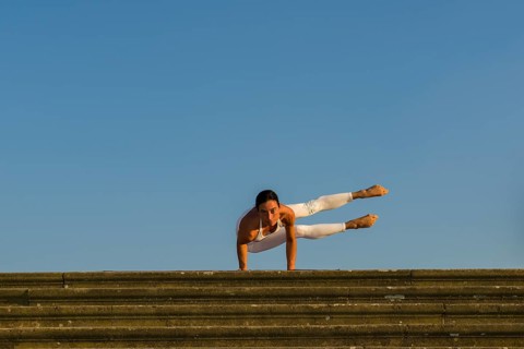 Young woman practising Hatha yoga