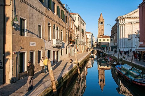 Rio de San Barnaba canal with reflections in the evening light