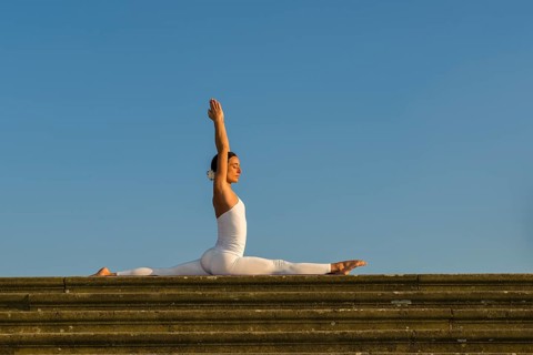 Young woman practising Hatha yoga