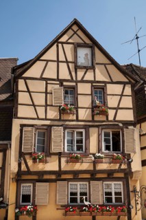 Half-timbered house with stork figures in the historic centre