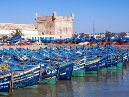 Old blue fishing boats in the port of Essaouira