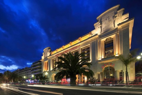 Hotel and Casino Palais de la Mediterranee on the Promenade des Anglais in the evening