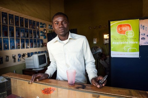 Local salesman in a small shop