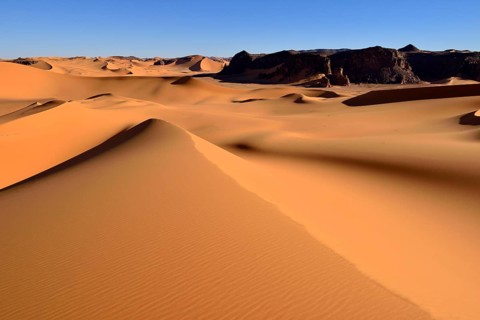 The sand dunes and rocks of Moul Naga