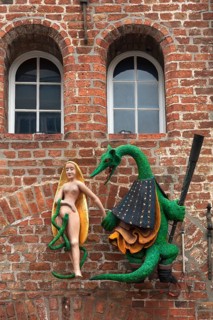 Figures of a dragon and a woman on the facade of the former Hieronymus Restaurant & Cafe