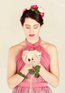 Beauty portrait of a young woman with flowers in her hair