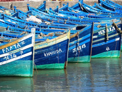 Old blue fishing boats in the port of Essaouira