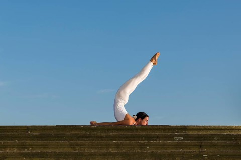 Young woman practising Hatha yoga