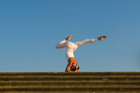Young woman practising Hatha yoga