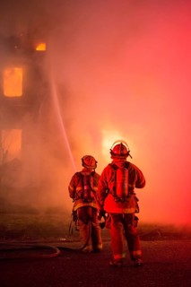 Firefighters battle a fire which destroyed a vacant home in Detroit's Morningside neighborhood